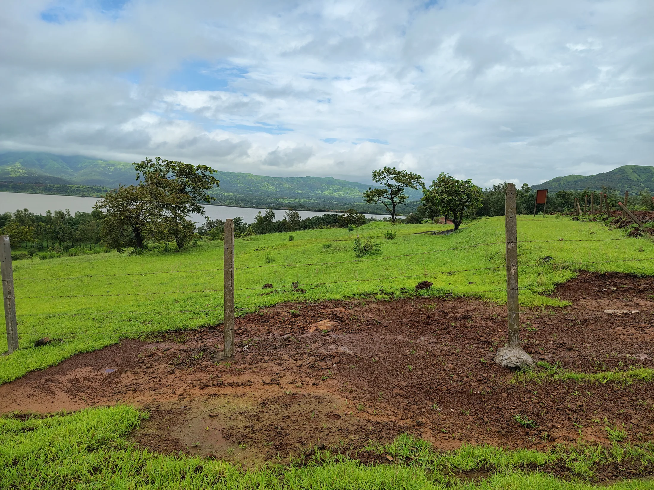 Farm plots overlooking the water and surrounding hills